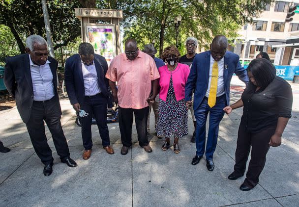 PHOTO: Attorney Ben Crump, second from right, joins in prayer with the family of Brianna Grier on July 29, 2022, in Decatur, Ga. (Ron Harris/AP)
