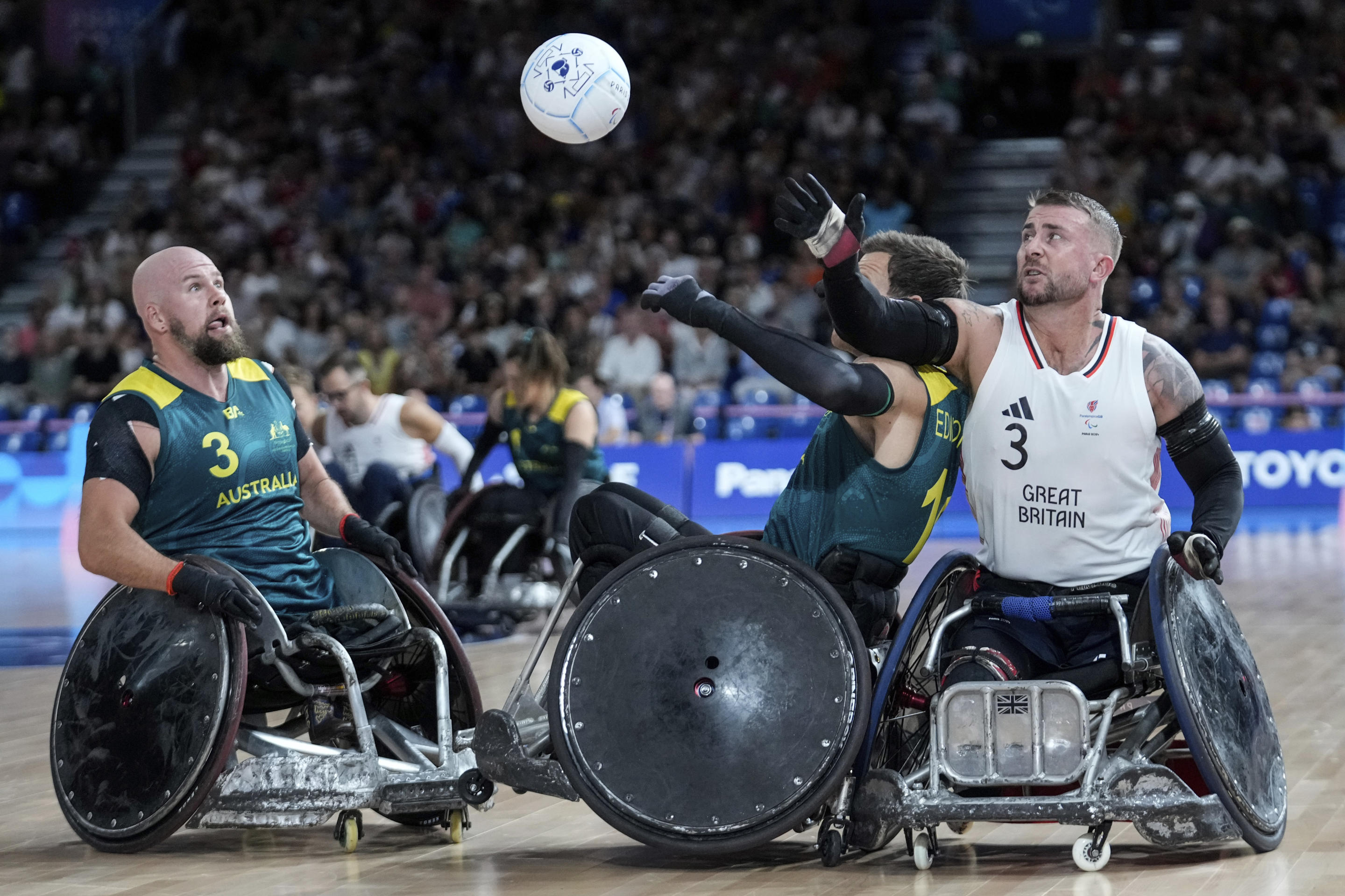 Men competing in wheelchair rugby.