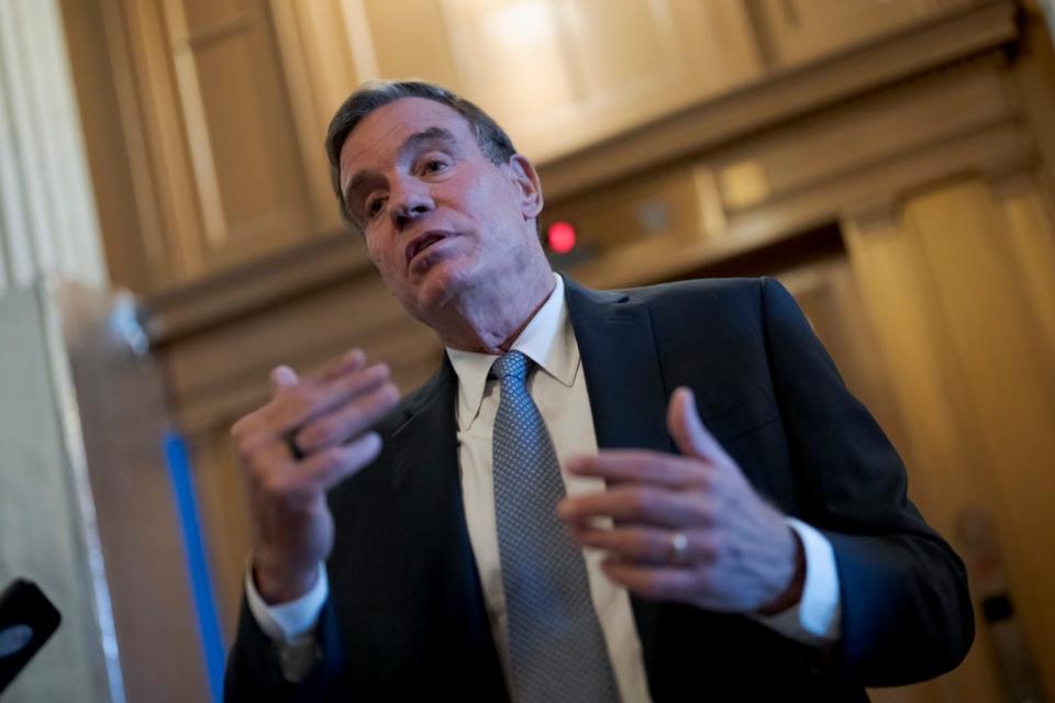 Sen. Mark Warner, D-Va., chair of the Senate Intelligence Committee, pauses to speak with reporters at the Capitol in Washington, Nov. 10, 2022. Warner and committee ranking member Sen. Marco Rubio, R-Fla. have argued that they have a right to review the documents to determine if there are any threats to national security.