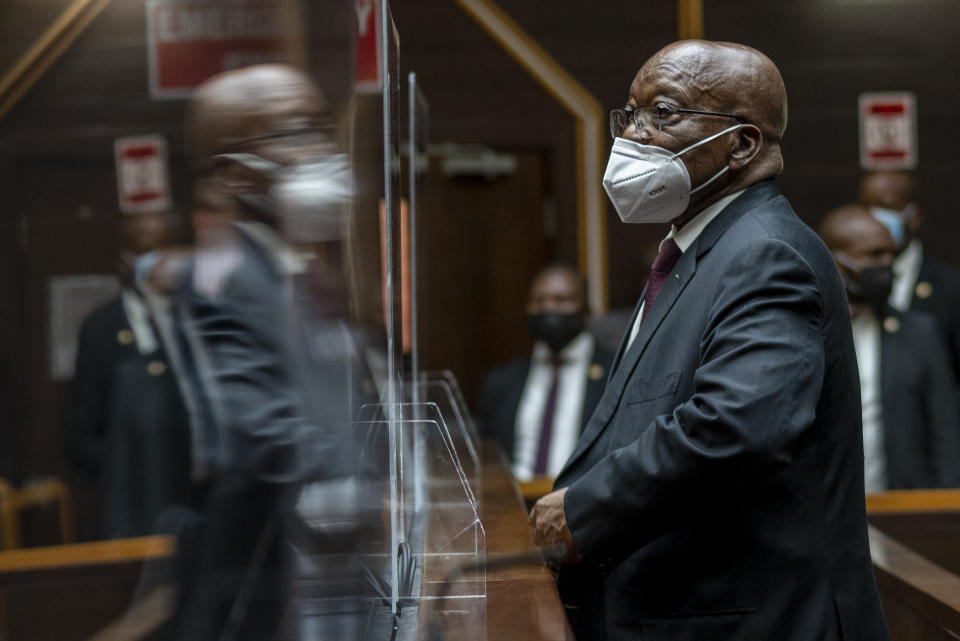 Former South African President Jacob Zuma, sits in the High Court in Pietermaritzburg, South Africa, Tuesday Oct. 26, 2021. Zuma has demanded to be acquitted of corruption charges because of the alleged abuse he has suffered at the hands of his prosecutors. He is in court facing charges of corruption, money laundering and racketeering. (AP Photo/Jerome Delay, Pool)