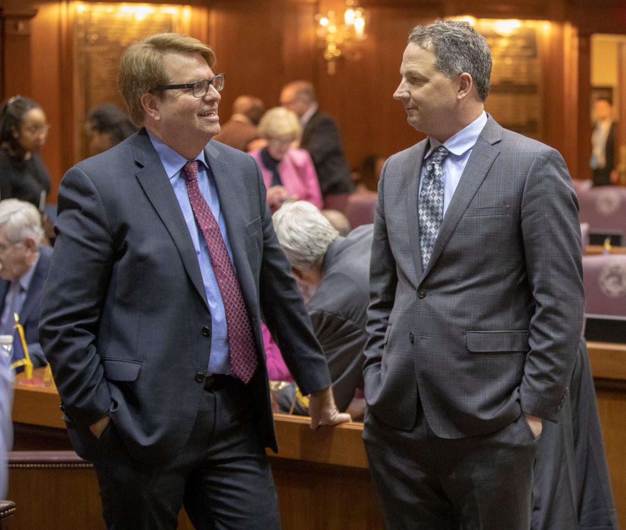 Phil GiaQuinta (left), Democrat and House Minority Leader, chats with Republican Todd Huston, Speaker of the House-elect, on the first day of the Indiana legislative session, Indiana Statehouse, Indianapolis, Monday, Jan. 6, 2020. 