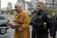 Former Penn State University assistant football coach Jerry Sandusky, left, arrives at the Centre County Courthouse for resentencing on his conviction of 45 counts of child sexual abuse Friday, Nov. 22, 2019, in Bellefonte, Pa. Sandusky was convicted in 2012 and sentenced to 30 to 60 years. (AP Photo/Gene J. Puskar)