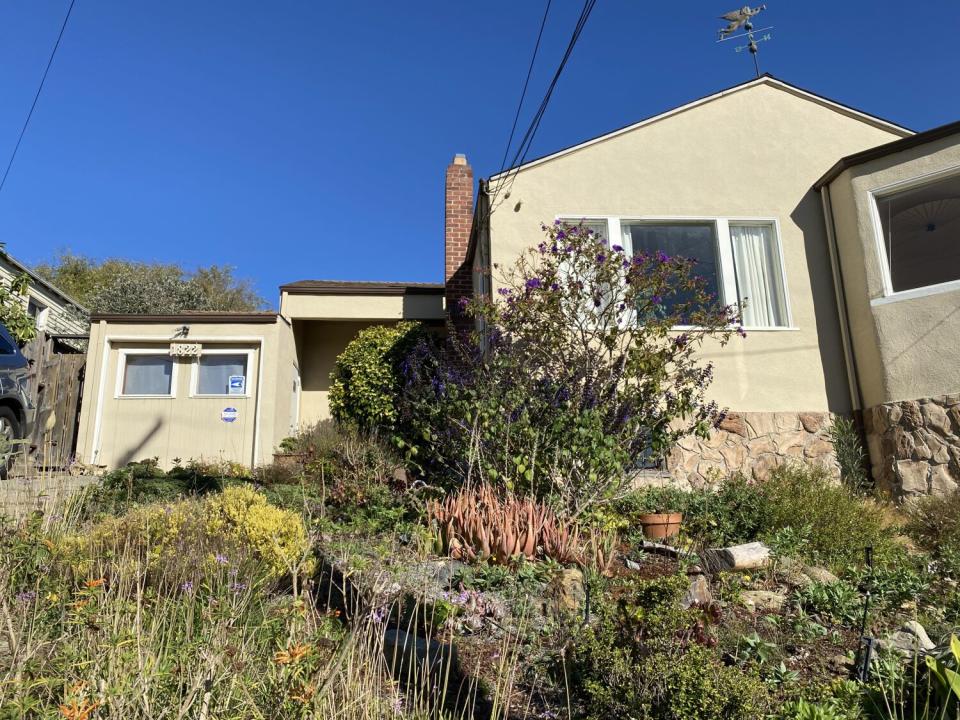 The exterior of a house and garage