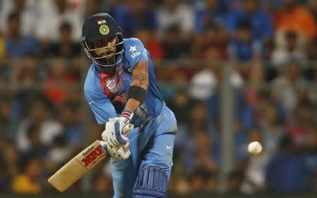 Cricket - West Indies v India - World Twenty20 cricket tournament semi-final - Mumbai, India - 31/03/2016. India's Virat Kohli plays a shot. REUTERS/Danish Siddiqui