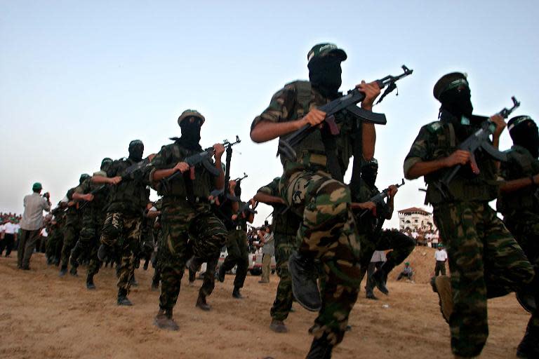 Masked Hamas militants take part in a 2005 rally next to the Gaza-Egypt border in Rafah