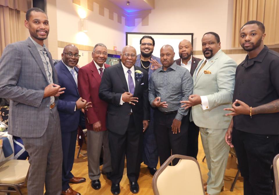 Rev. Ronald Fowler, center, with his Kappa Alpha Psi brothers at the Summit County Sports Hall of Fame banquet Tuesday at Annunciation Greek Orthodox Church in Akron.