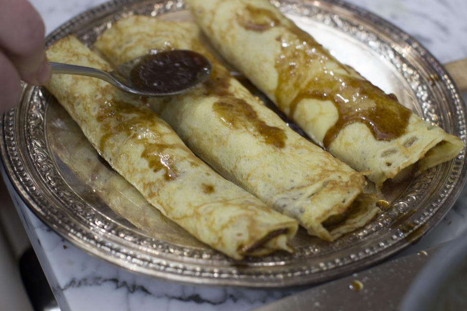 This Jan. 12, 2015 photo shows the making of bananas Foster crepes in Concord, N.H. (AP Photo/Matthew Mead)