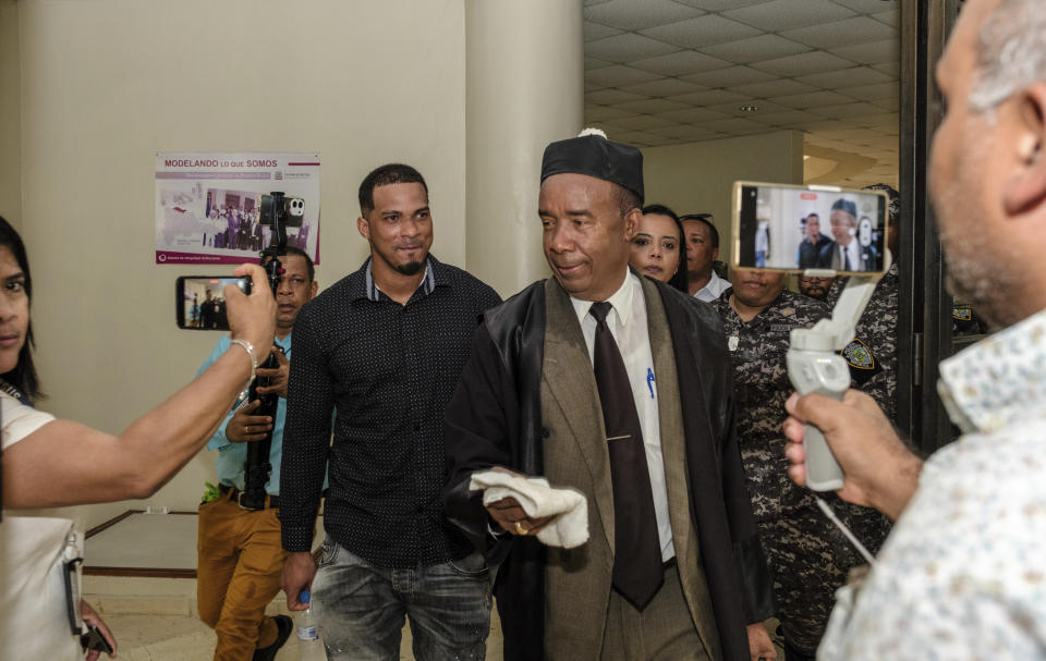 Tampa Bay Rays shortstop Wander Franco, center left, who is charged with sexual abuse of a 14-year-old girl, leaves court accompanied by his lawyer Teodosio Jaquez, right center, in Puerto Plata, Dominican Republic, Wednesday, Aug. 14, 2024. (AP Photo/Ricardo Hernandez)