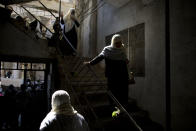 <p>Druse women walk down the stairs during a rally demanding the return of the Golan Heights, captured by Israel in 1967, close to the Syrian border in Majdal Shams in the Golan Heights, Feb. 14, 2014. (Photo: Oded Balilty/AP) </p>