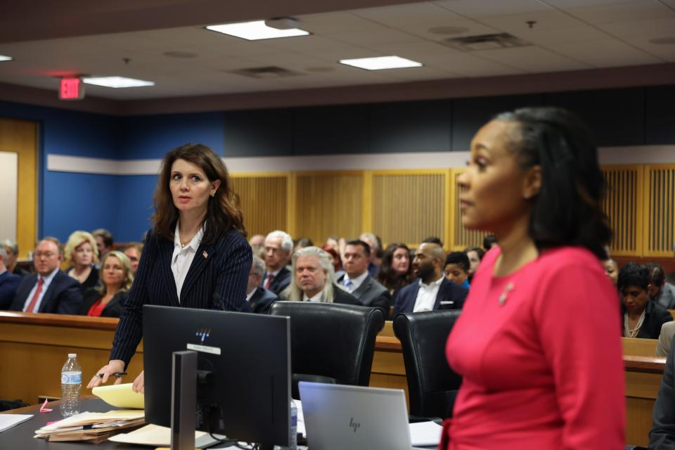 ATLANTA, GA - FEBRUARY 15: Fulton County Special prosecutor Anna Cross, who is representing the Fulton County District Attorney's office, looks at District Attorney Fani Willis as she enters the courtroom during a hearing in the case of the State of Georgia v. Donald John Trump at the Fulton County Courthouse on February 15, 2024 in Atlanta, Georgia. Judge Scott McAfee is hearing testimony as to whether Willis and Special Prosecutor Nathan Wade should be disqualified from the case for allegedly lying about a personal relationship. (Photo by Alyssa Pointer-Pool/Getty Images)