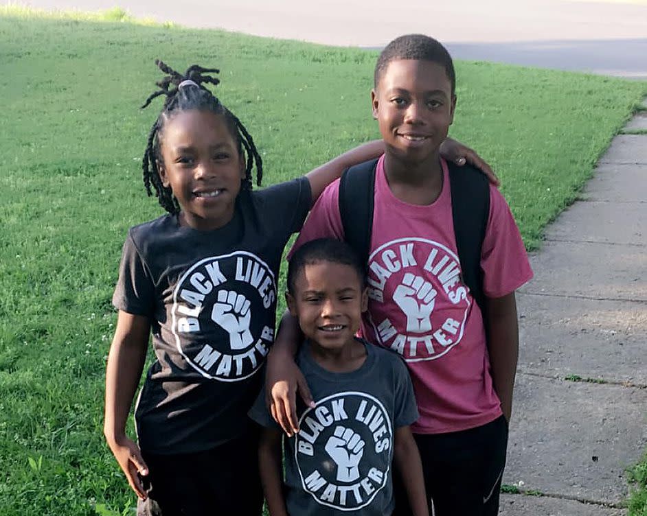 Jordan Herbert says her son Ben (far left) was disciplined at Charles Evans Elementary last month due to the school’s decision the shirt violated a policy from the school’s superintendent barring political apparel.