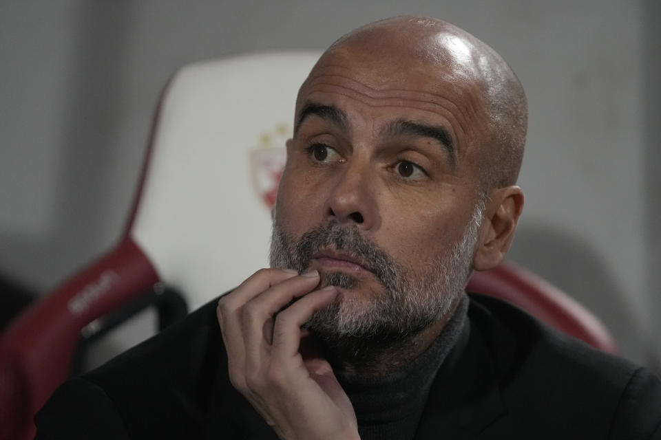 Manchester City's head coach Pep Guardiola waits for the start of the Group G Champions League soccer match between Red Star and Manchester City, at the Rajko Mitic Stadium in Belgrade, Serbia, Wednesday, Dec. 13, 2023. (AP Photo/Darko Vojinovic)