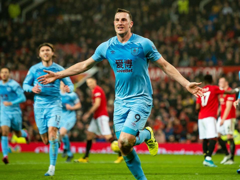 Chris Wood celebrates putting Burnley in front at Old Trafford: EPA