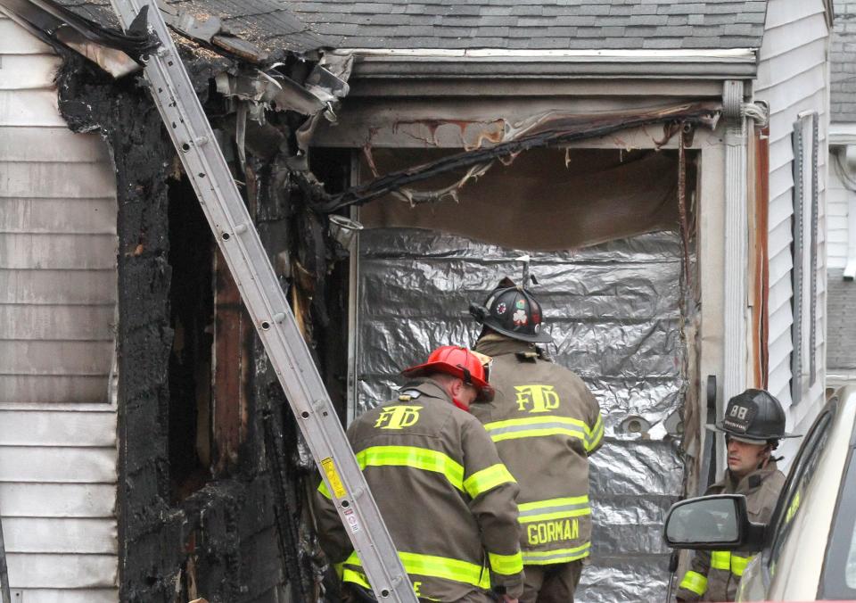 Tiverton firefighters responding to a house fire in 2020.