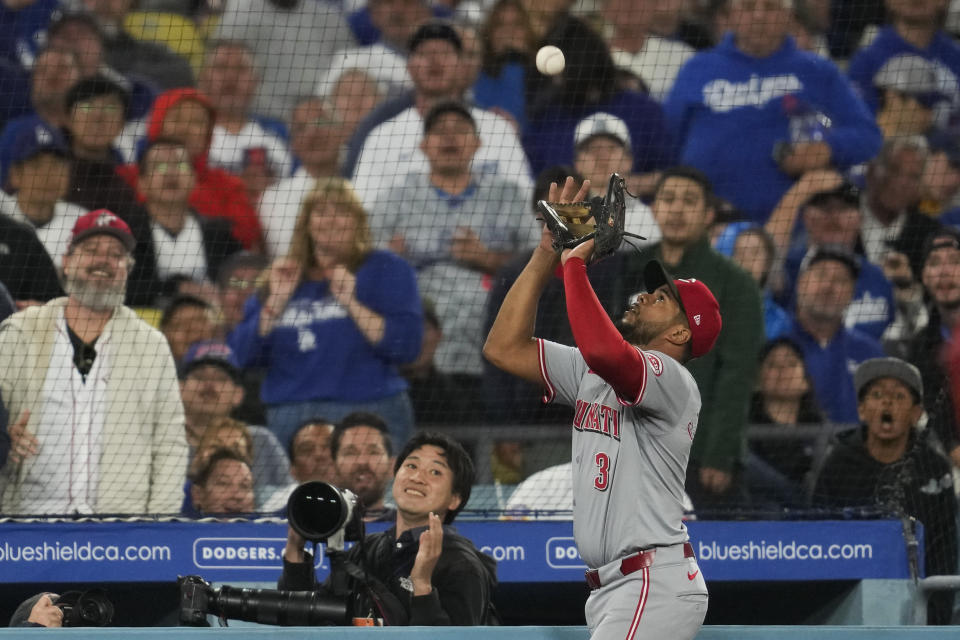 Cincinnati Reds third baseman Jeimer Candelario (3) catches a foul ball hit by Los Angeles Dodgers' Kikè Hernández during the fourth inning of a baseball game in Los Angeles, Thursday, May 16, 2024. (AP Photo/Ashley Landis)