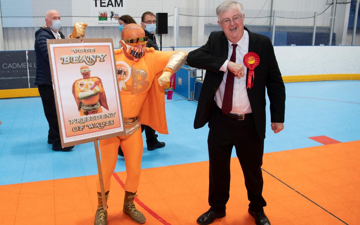 Mark Drakeford, right, with Captain Beany at his vote count in Cardiff West - GETTY IMAGES