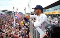 Britain Formula One - F1 - British Grand Prix 2016 - Silverstone, England - 10/7/16 Mercedes' Lewis Hamilton celebrates with fans after winning the race REUTERS/Matthew Childs Livepic