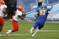 Sam Houston State wide receiver Jequez Ezzard (12) runs for a touchdown as South Dakota State defensive end Reece Winkelman (97) chases him during the first half of the NCAA college FCS Football Championship in Frisco, Texas, Sunday, May 16, 2021. (AP Photo/Michael Ainsworth)