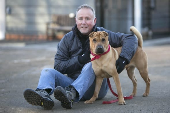 Dog abandoned at train station with suitcase gets a new home