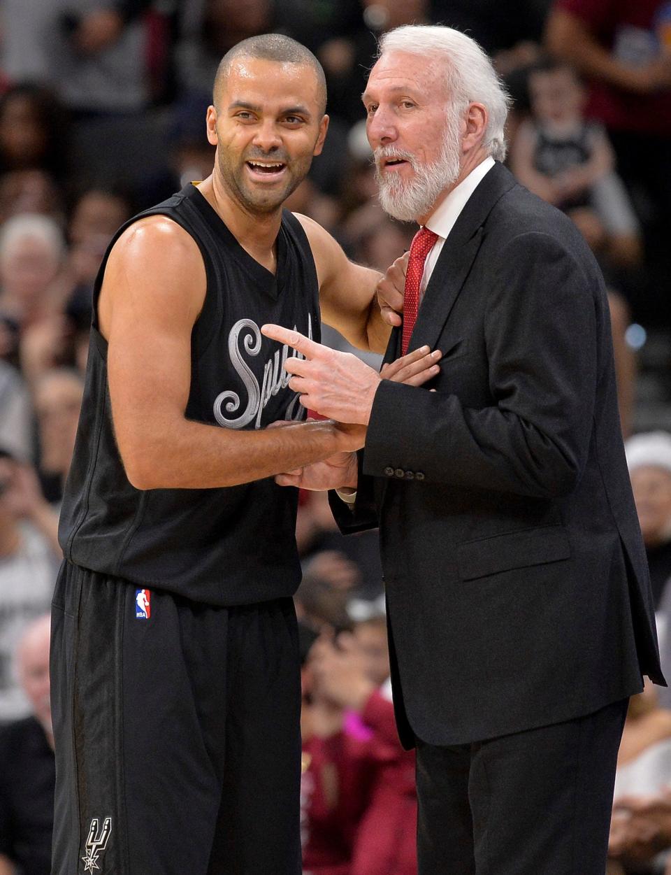 Gregg Popovich shares a moment with guard Tony Parker during a game in 2016.