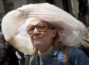 A woman smiles during the annual Easter Bonnet Parade in New York April 20, 2014. REUTERS/Carlo Allegri (UNITED STATES - Tags: SOCIETY)