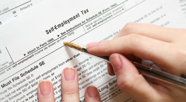 filling-out-a-self-employment-tax-form-SmartAsset