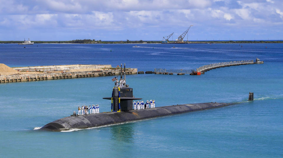 FILE - In this photo provided by U.S. Navy, the Los Angeles-class fast attack submarine USS Oklahoma City (SSN 723) returns to U.S. Naval Base in Guam, Aug. 19, 2021. The powerful Pacific typhoon Mawar that lashed of Guam on Thursday, May 25, 2023, with damaging high winds, heavy rains and a dangerous storm surge arrived as the worst storm in decades, interrupting life for residents and the U.S. military on a tropical island that is the easternmost of the nation's territories. (Mass Communication Specialist 3rd Class Naomi Johnson/U.S. Navy via AP, File)