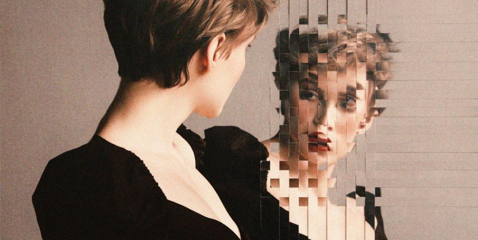 a woman looking in the mirror at a distorted reflection