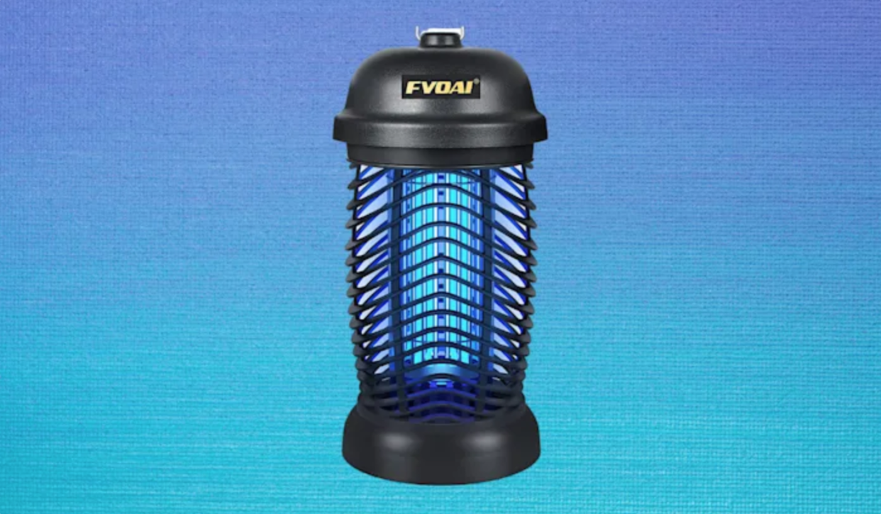 A black electric bug zapper with blue light inside