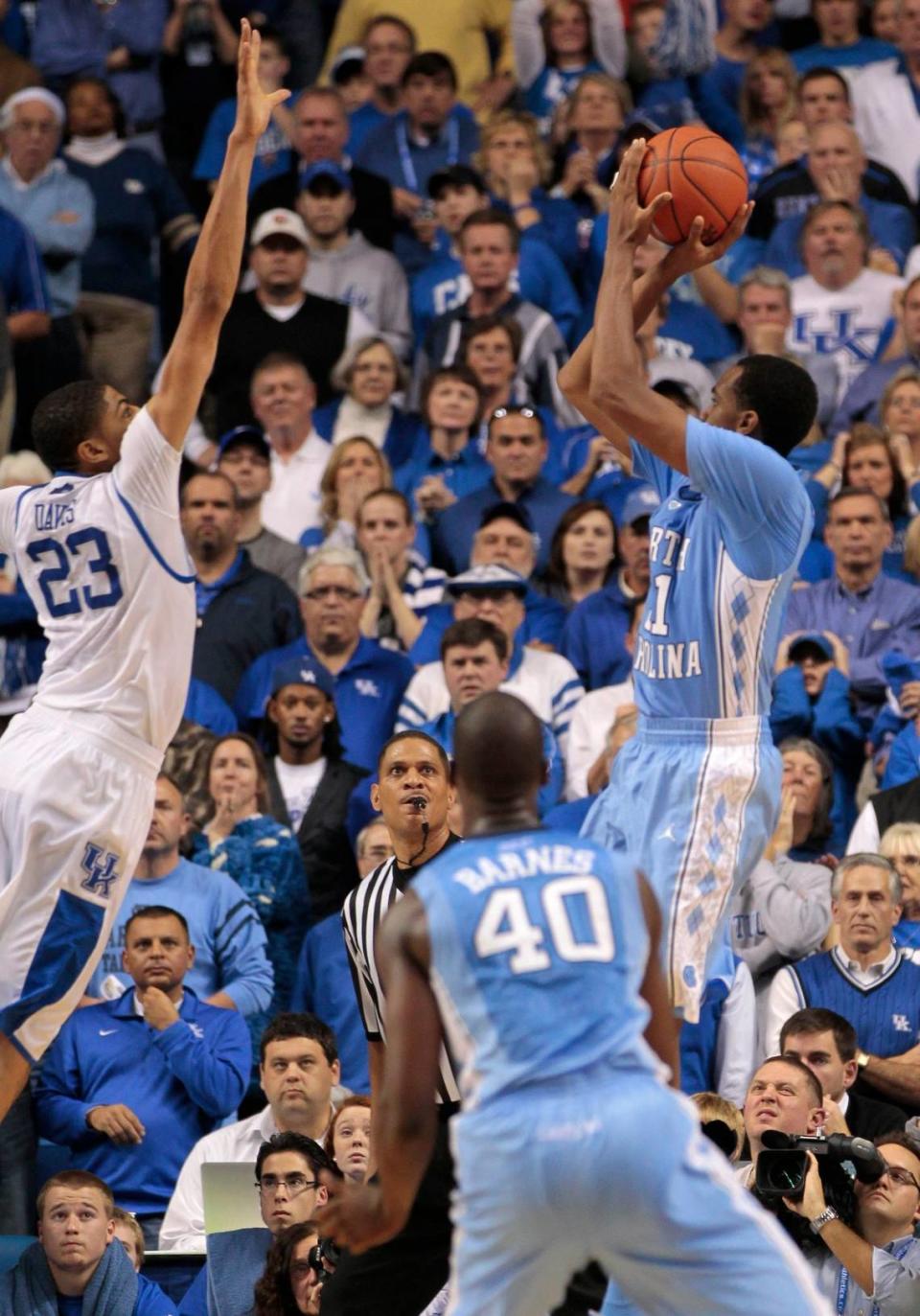 Kentucky’s Anthony Davis (23) blocks a last-second shot attempt by North Carolina’s John Henson to preserve a UK victory over the Tar Heels in Rupp Arena in December 2011.