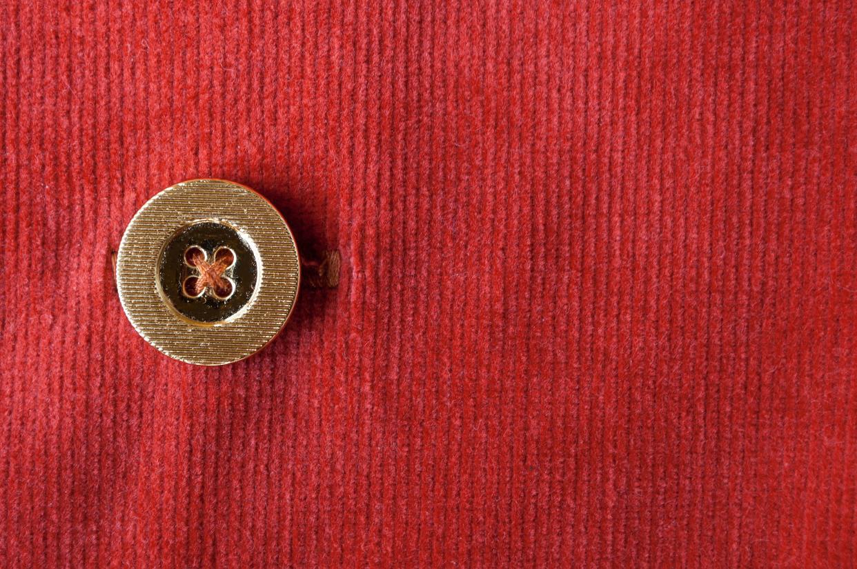 Red corduroy with a gold button.