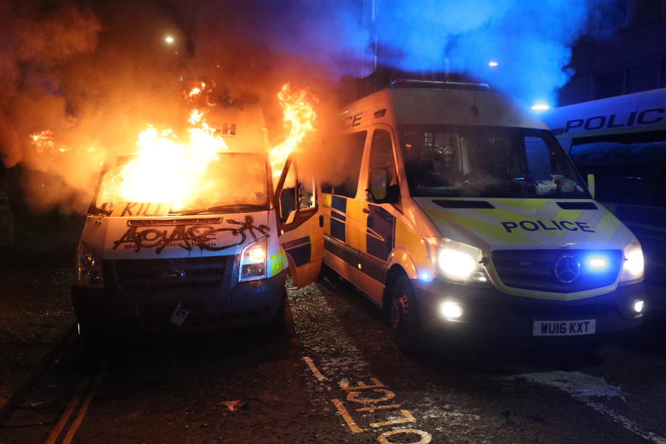 A vandalised police van on fire outside Bridewell Police Station, as other police vehicles arrive after protesters demonstrated against the Government&#39;s controversial Police and Crime Bill. Picture date: Sunday March 21, 2021. (Photo by Andrew Matthews/PA Images via Getty Images)