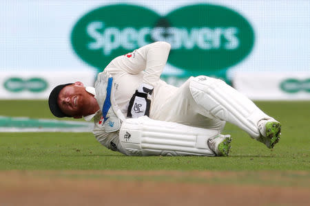 Cricket - England v India - Third Test - Trent Bridge, Nottingham, Britain - August 20, 2018 England's Jonny Bairstow reacts after sustaining an injury Action Images via Reuters/Paul Childs
