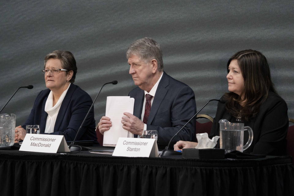 Commissioners, from left, Leanne Fitch, Michael MacDonald, chair, and Kim Stanton deliver the final report of the Mass Casualty Commission inquiry in Truro, Nova Scotia, Thursday, March 30, 2023. (Darren Calabrese/The Canadian Press via AP)