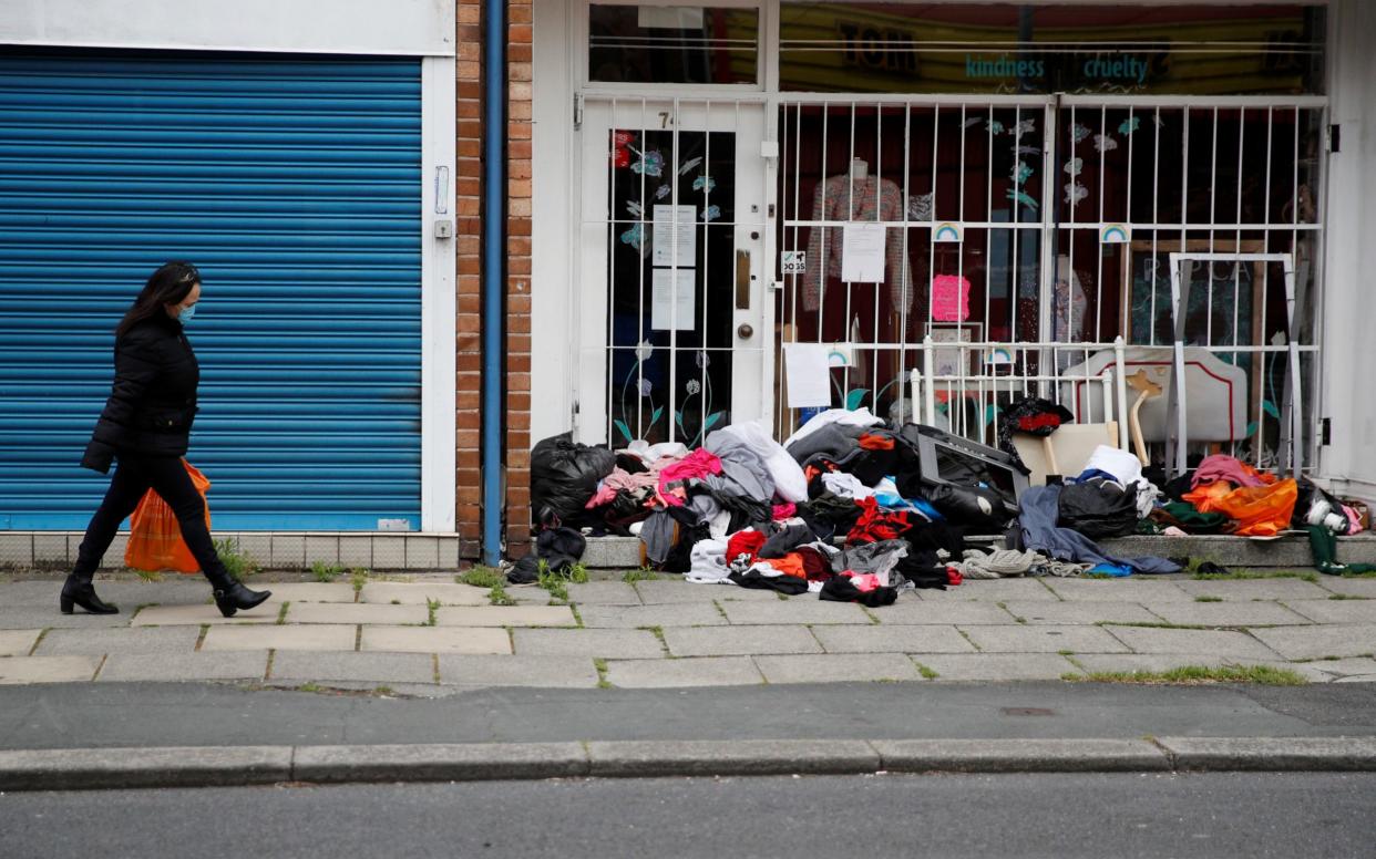 A pile of items left outside a charity shop in Urmston, Greater Manchester, last year - REUTERS