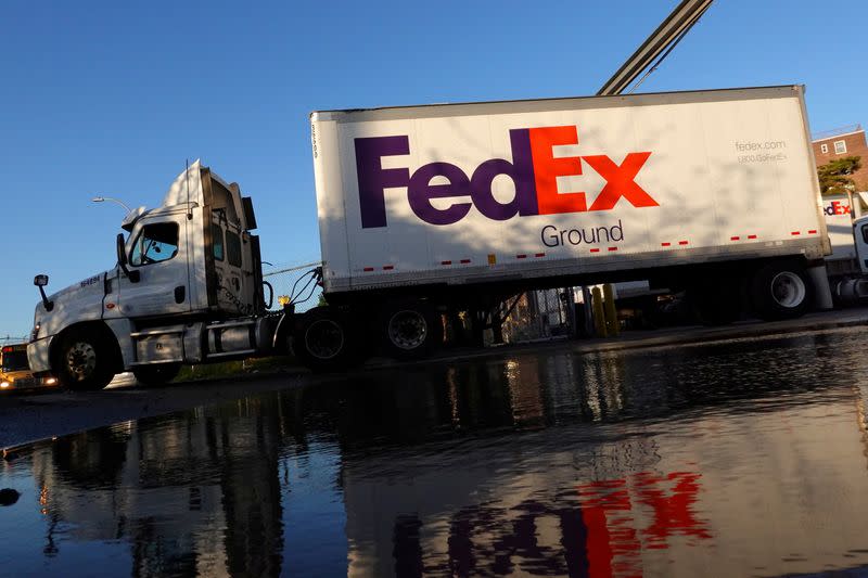 FILE PHOTO: A FedEx delivery truck exits a facility in Brooklyn, New York City