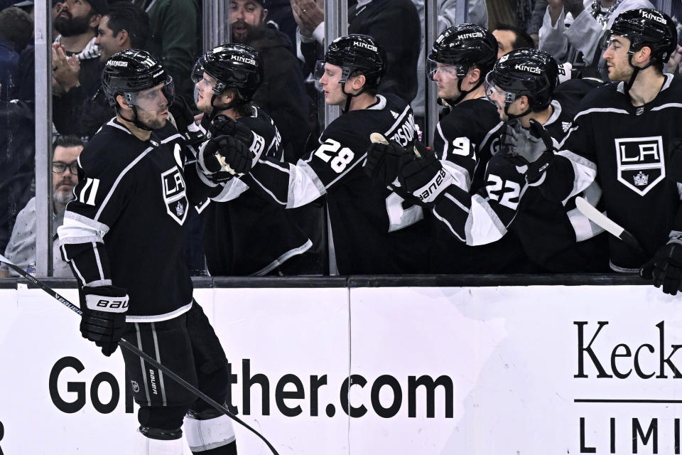 Los Angeles Kings center Anze Kopitar is congratulated for his goal against the Arizona Coyotes during the third period of an NHL hockey game in Los Angeles, Thursday, Dec. 1, 2022. (AP Photo/Alex Gallardo)