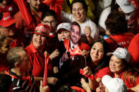 Supporters of Paraguay’s newly elected President Mario Abdo Benitez of the Colorado Party celebrate in Asuncion, Paraguay, April 22, 2018. REUTERS/Jorge Adorno