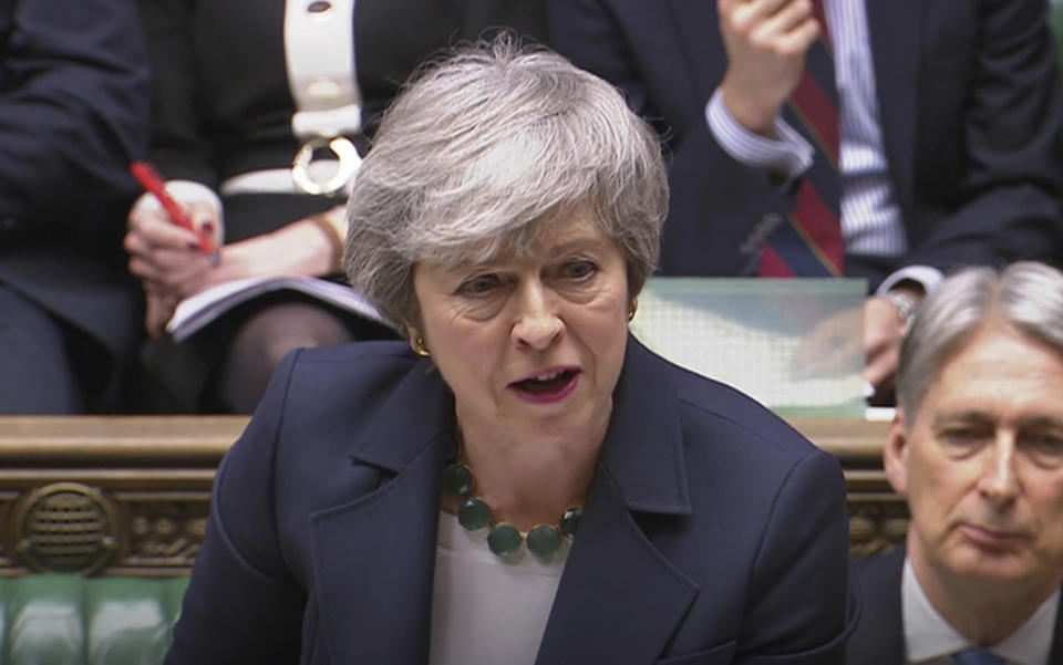 Britain's Prime Minister Theresa May speaks during Prime Minister's Questions inside the House of Commons in London, Wednesday March 13, 2019. Britain and the European Union seem braced Wednesday for a chaotic, cliff-edge Brexit, as Britain’s Parliament is set to hold further votes over the split with European Union. (House of Commons/PA via AP)