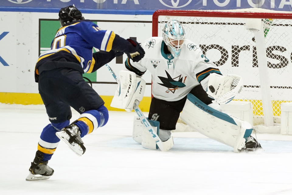 San Jose Sharks goaltender Martin Jones, right, stops a shot by St. Louis Blues' Brayden Schenn during a shootout of an NHL hockey game Wednesday, Jan. 20, 2021, in St. Louis. (AP Photo/Jeff Roberson)