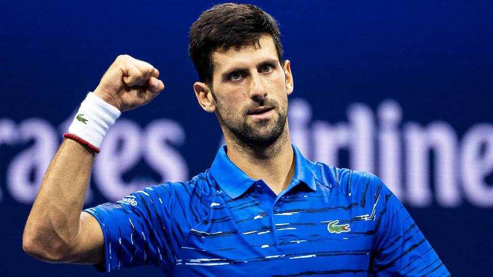 Novak Djokovic fist-pumping after winning a point.