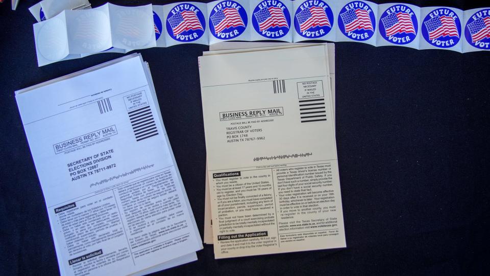 Voter registration forms were handed out at Crockett High's graduation Tuesday.