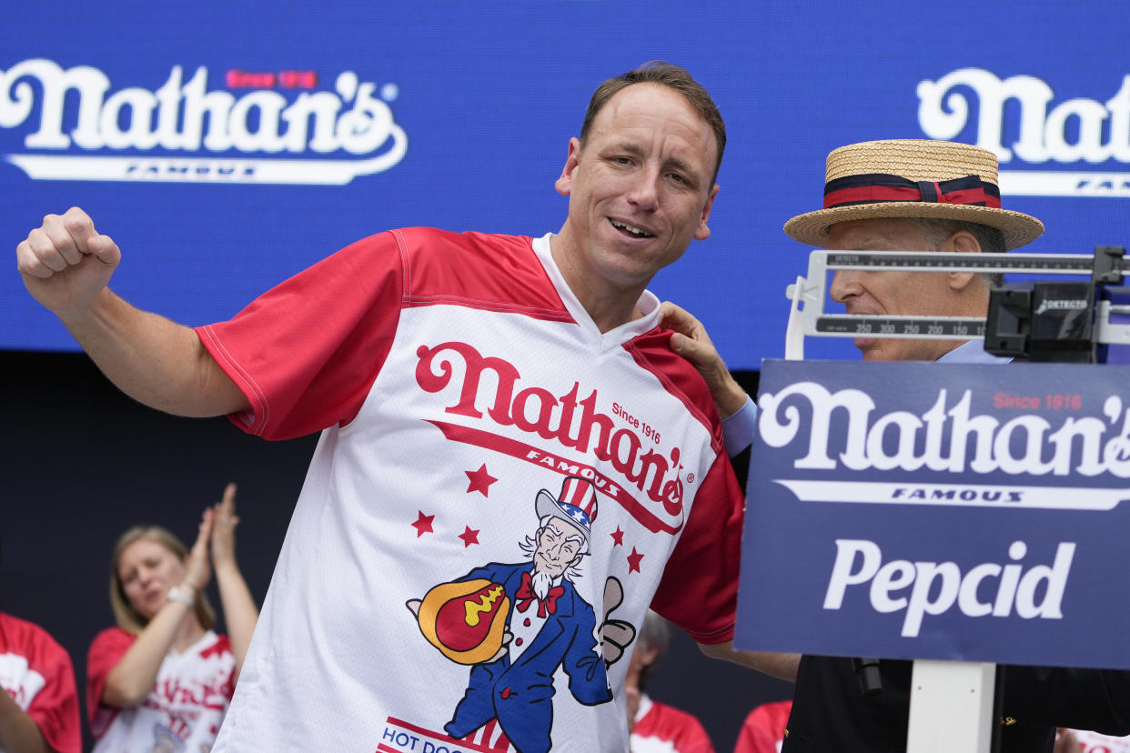 Competitive eater Joey Chestnut tries to win another Nathan's Hot Dog Eating Contest on Tuesday. (AP Photo/John Minchillo)