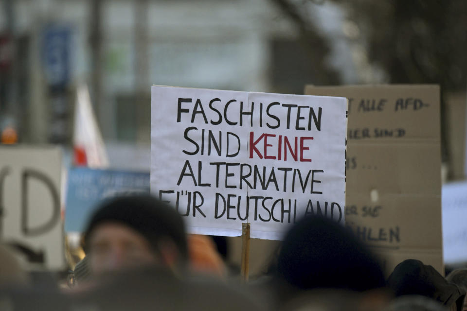 A person holds a banner reading 'Fascists are no alternative for Germany' during a march in Heidelberg, Germany, Saturday Jan. 20, 2024, as part of nationwide demonstrations against right-wing extremism. ( Jason Tschepljakow/dpa via AP)