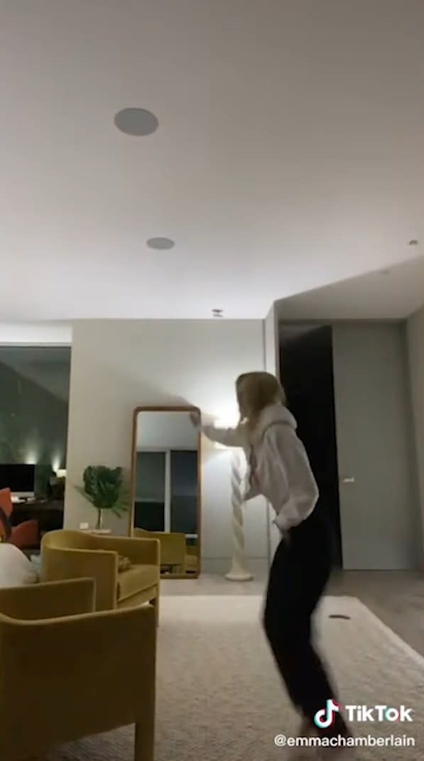 Emma dancing in a hotel room