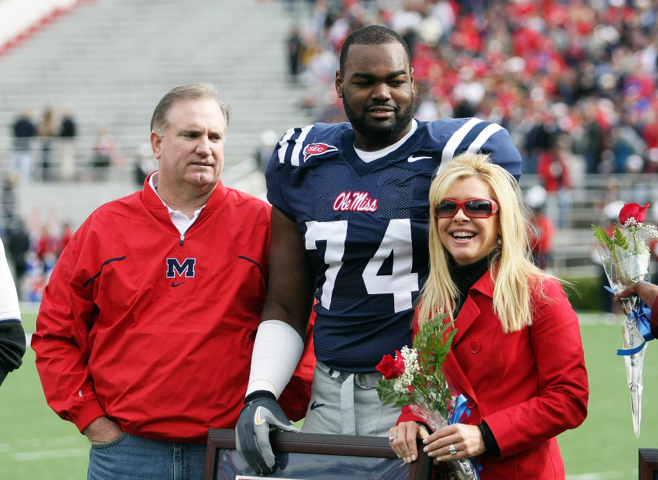 Michael Oher #74 of the Ole Miss Rebels stands with his family  (Matthew Sharpe / Getty Images)
