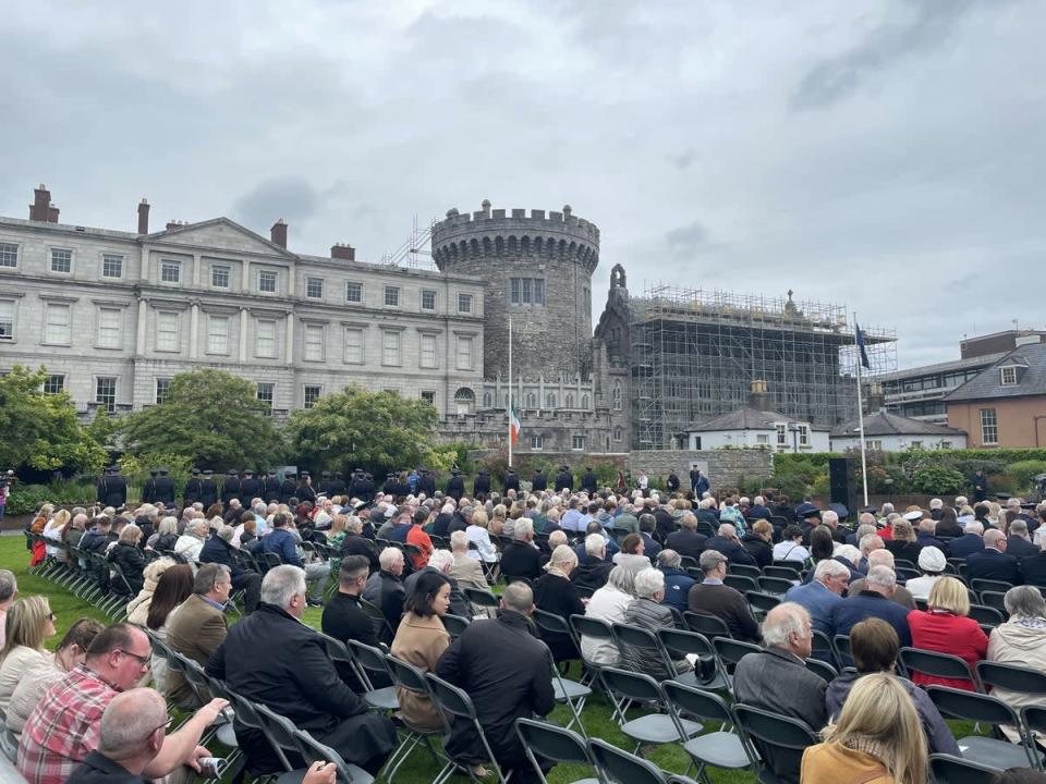 People attend the Garda Memorial event, an annual event to honour gardai who died in the course of their duty, at Dublin Castle, Ireland, in May (PA) (PA Wire)
