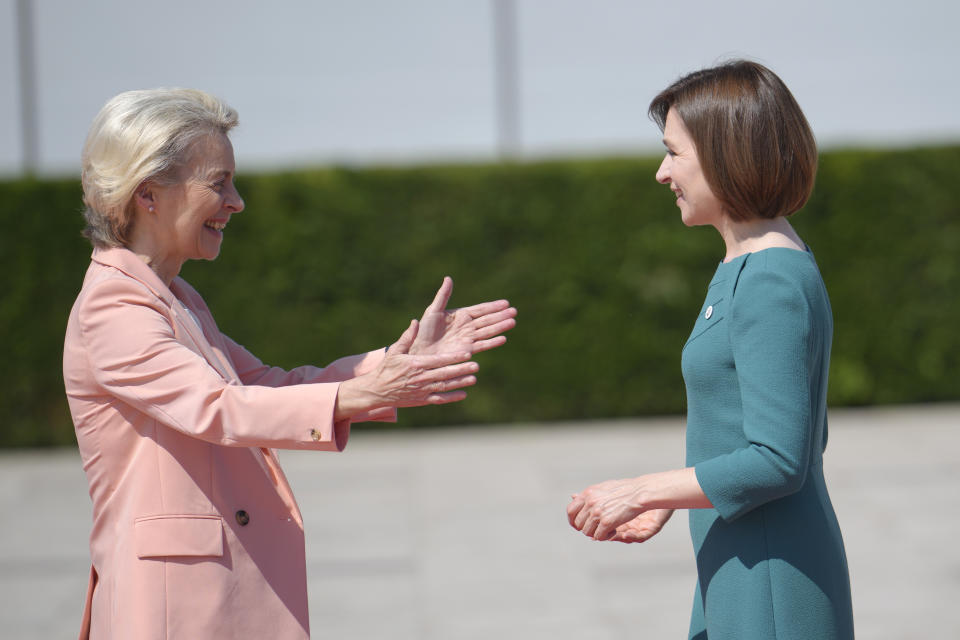 Moldova's President Maia Sandu, right, greets European Commission President Ursula von der Leyen during arrivals for the European Political Community Summit at the Mimi Castle in Bulboaca, Moldova, Thursday, June 1, 2023. Leaders are meeting in Moldova Thursday for a summit aiming to show a united front in the face of Russia's war in Ukraine and underscore support for the Eastern European country's ambitions to draw closer to the West and keep Moscow at bay. (AP Photo/Vadim Ghirda)