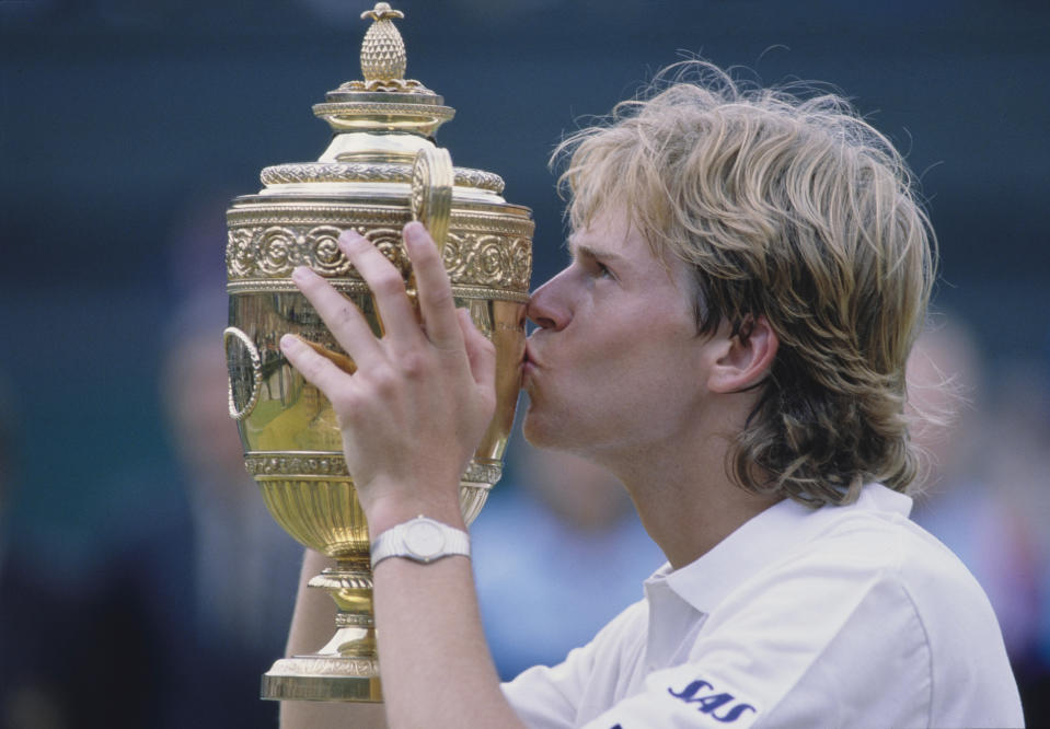 Stefan Edberg from Sweden kisses the Gentlemen's Singles Championship Trophy after defeating Boris Becker of Germany in their Men's Singles Final match at the Wimbledon Lawn Tennis Championship on 4th July 1988 at the All England Lawn Tennis and Croquet Club in Wimbledon, London, England.  Stefan Edberg won the match  4 - 6, 7 - 6, 6 - 4, 6 - 2.  (Photo by Steve Powell/Allsport/Getty Images)