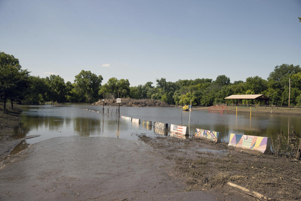 After flooding in the area over the weekend, Rotary Park finally emerges from the depths of the Big Sioux River. Wednesday, June 26, 2024, in Canton, SD. (AP Photo/Josh Jurgens)